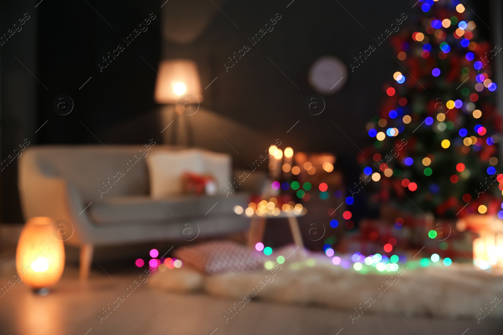 Photo of Blurred view of stylish room interior with decorated Christmas tree