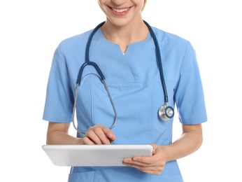 Medical doctor with stethoscope using tablet isolated on white, closeup