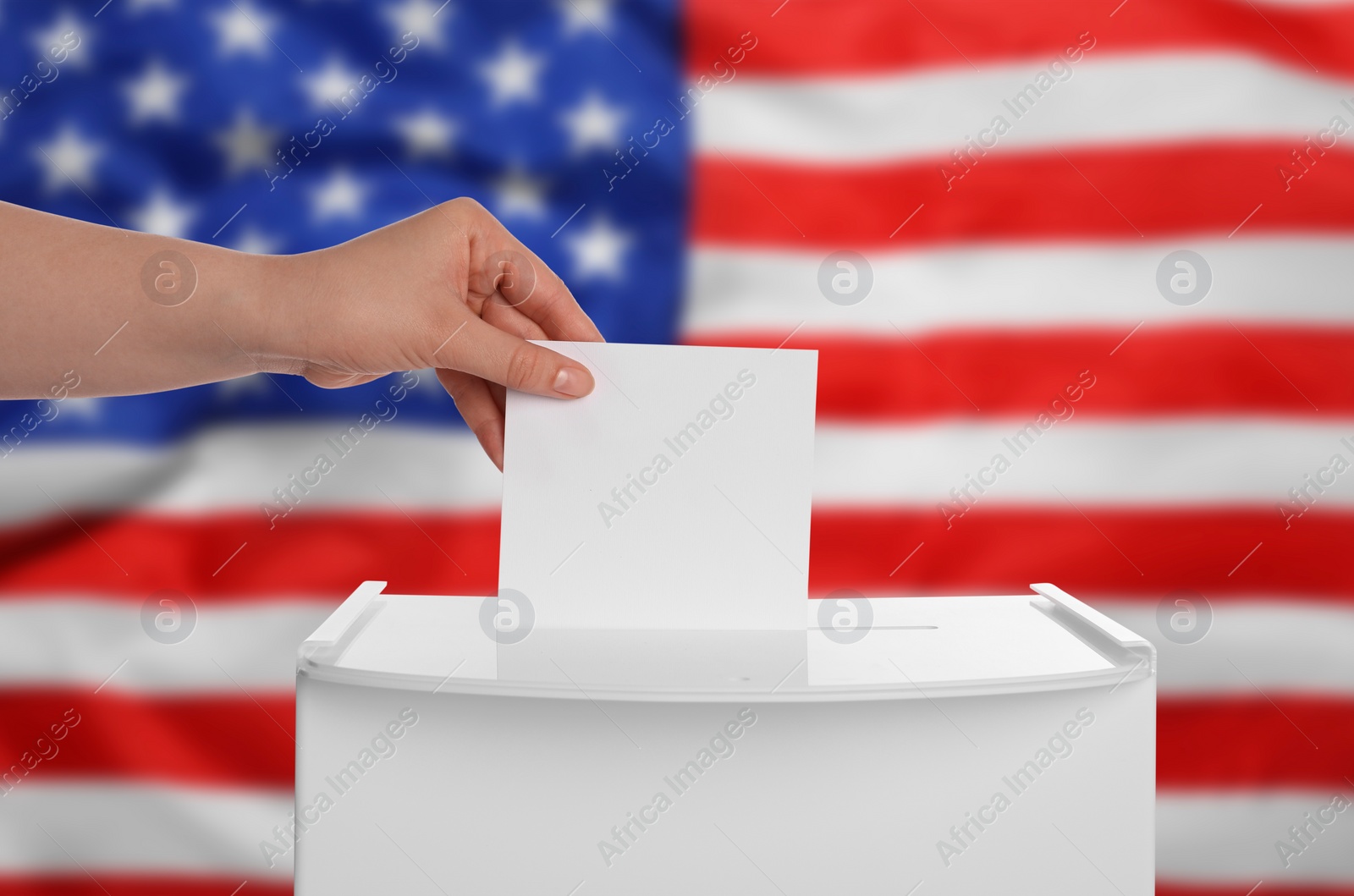 Image of Election in USA. Woman putting her vote into ballot box against national flag of United States, closeup