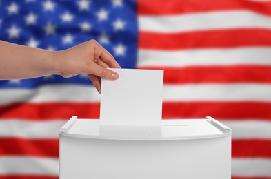 Image of Election in USA. Woman putting her vote into ballot box against national flag of United States, closeup
