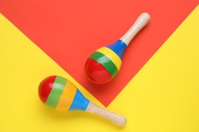 Photo of Maracas on colorful background, flat lay. Musical instrument