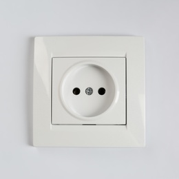 Photo of Power socket on white background. Electrician's equipment