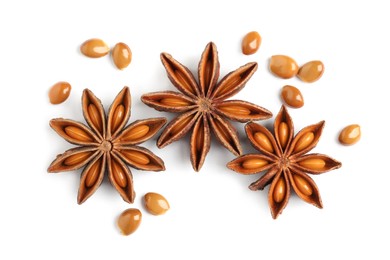 Dry anise stars with seeds on white background, top view