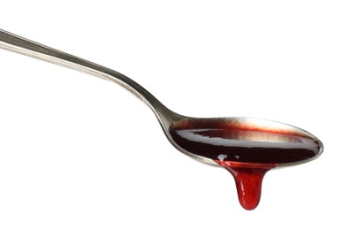 Spoon with tasty sweet jam isolated on white