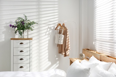 Stylish bedroom with modern chest of drawers