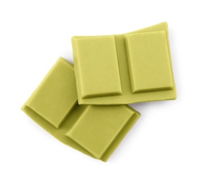 Photo of Pieces of tasty matcha chocolate bar isolated on white, top view