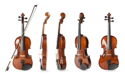 Image of Set of classic violins on white background