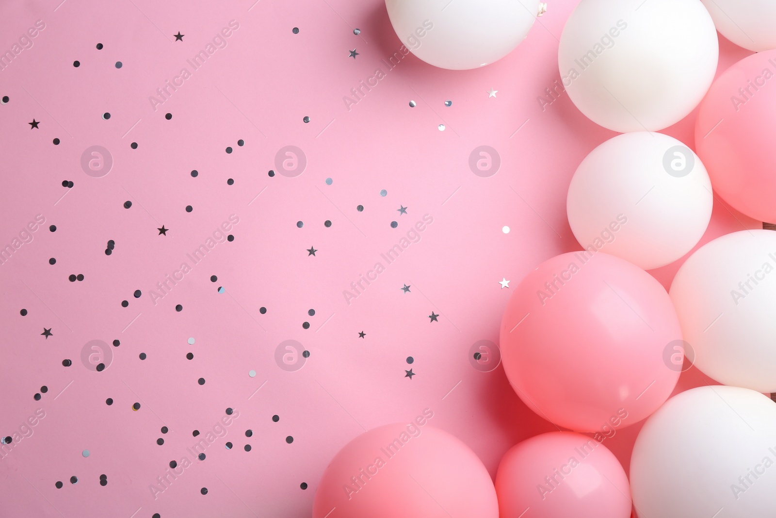 Photo of Flat lay composition with air balloons and space for text on color background