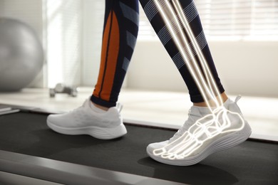 Image of Digital composite of highlighted bones and woman training on walking treadmill indoors, closeup