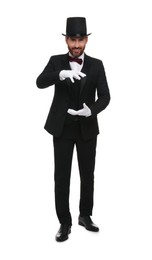 Happy magician in top hat holding something on white background