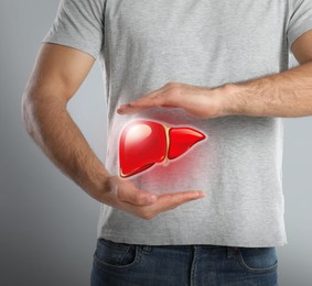Image of Man and illustration of healthy liver on grey background, closeup