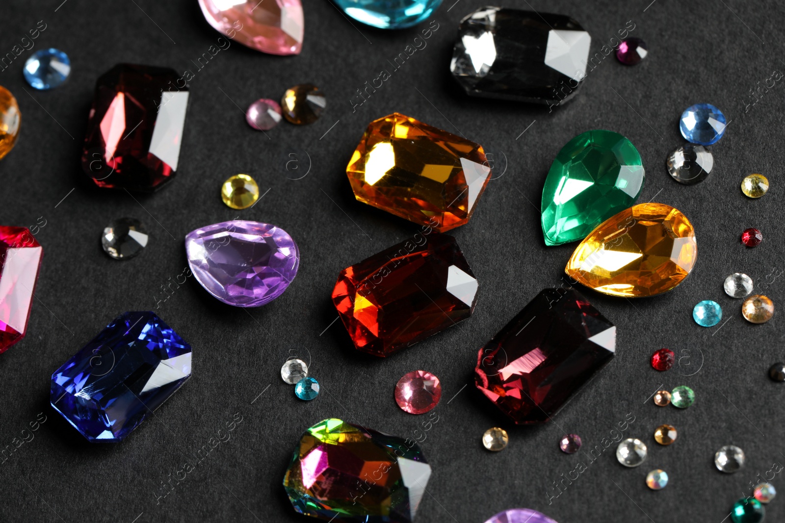 Photo of Beautiful gemstones for jewelry on dark background