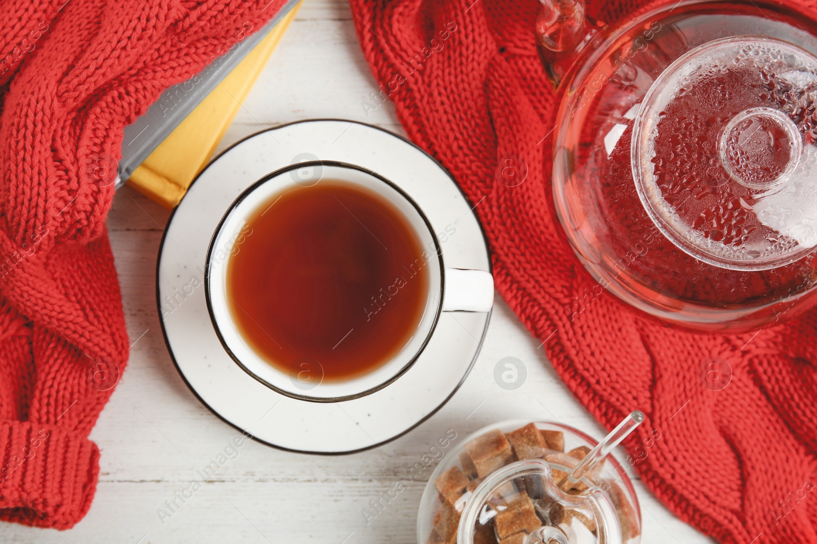 Photo of Flat lay composition with cup of hot tea on white wooden table. Winter drink