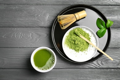 Photo of Flat lay composition with matcha tea on wooden background