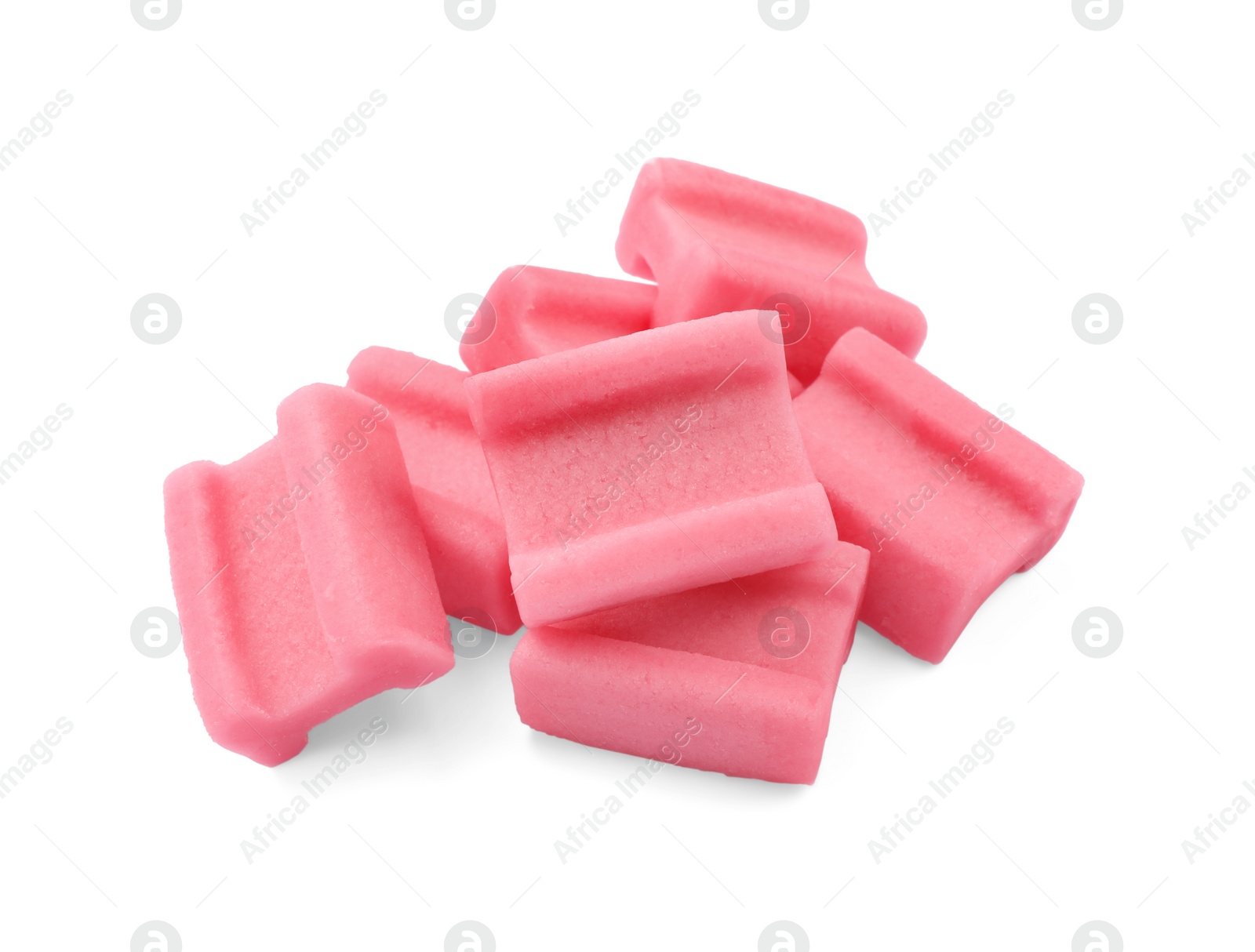 Photo of Pile of tasty pink chewing gums on white background