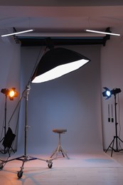 Casting call. Chair and different equipment in modern studio