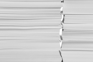 Photo of Stacks of paper sheets on white background