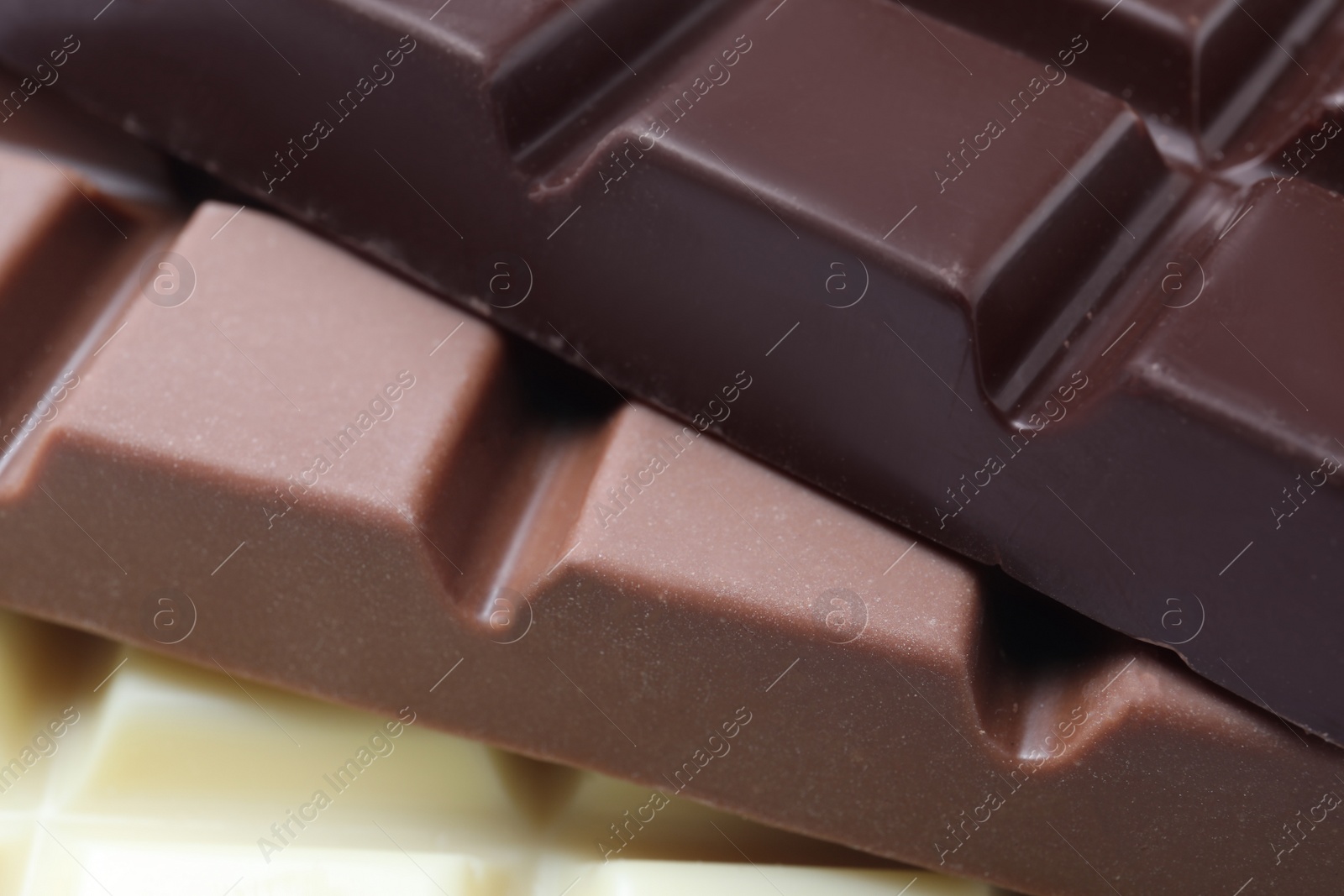 Photo of Different delicious chocolate as background, closeup view