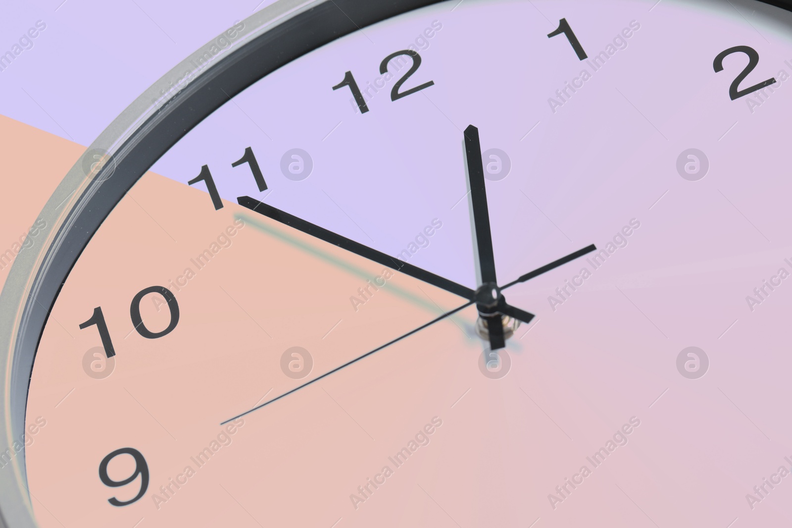 Image of Closeup view of clock, color toned effect. Time concept