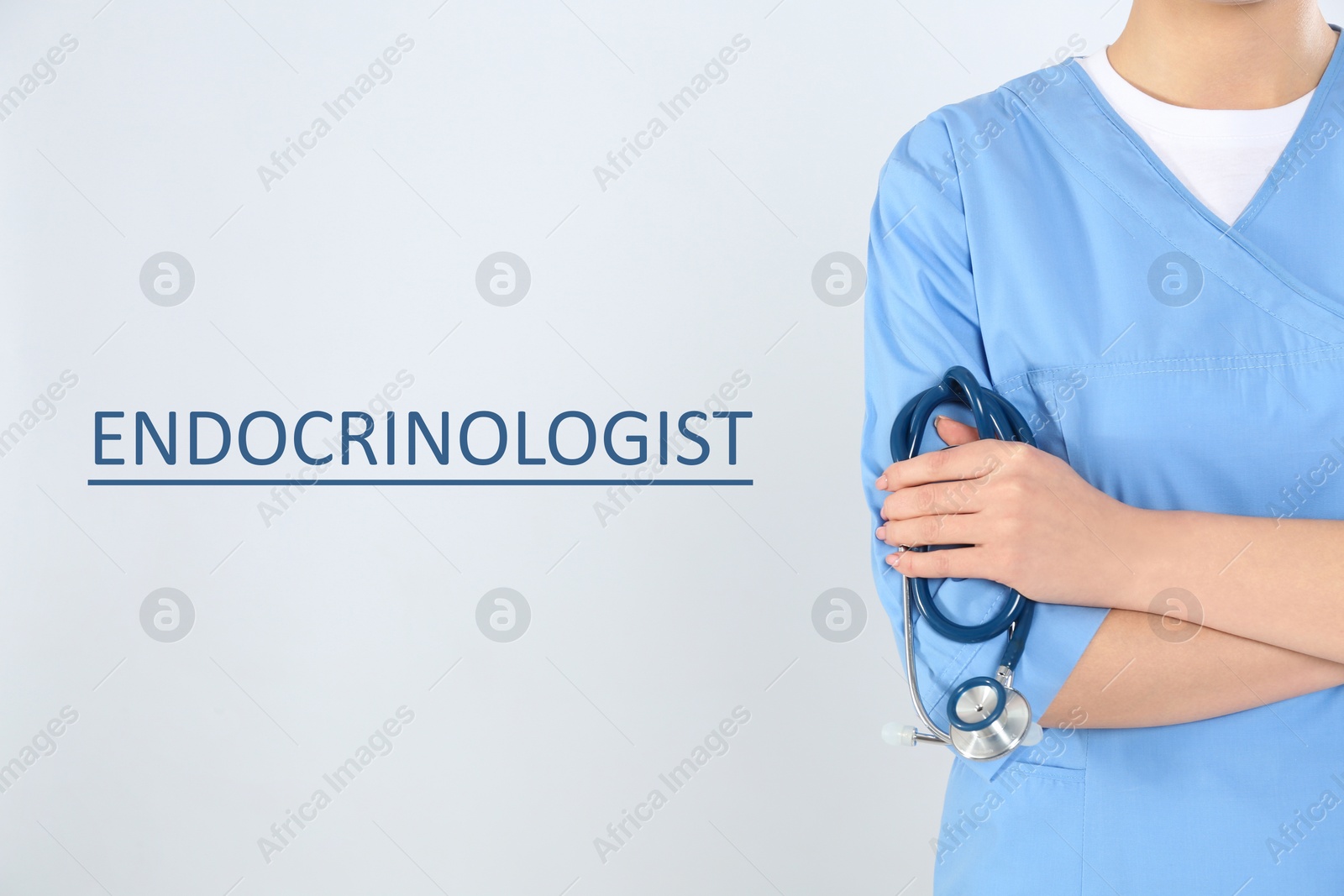 Image of Endocrinologist with stethoscope on light grey background, closeup