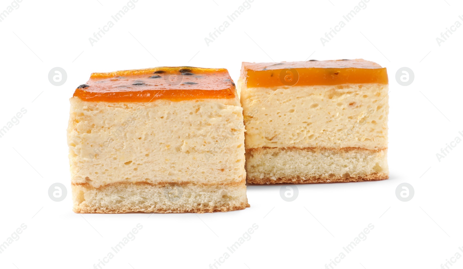 Photo of Pieces of cheesecake with jelly on white background