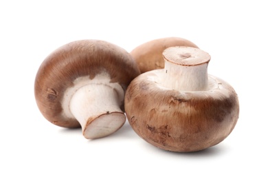 Photo of Fresh champignon mushrooms isolated on white. Healthy food