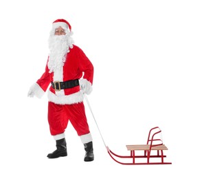 Photo of Man in Santa Claus costume with sleigh posing on white background