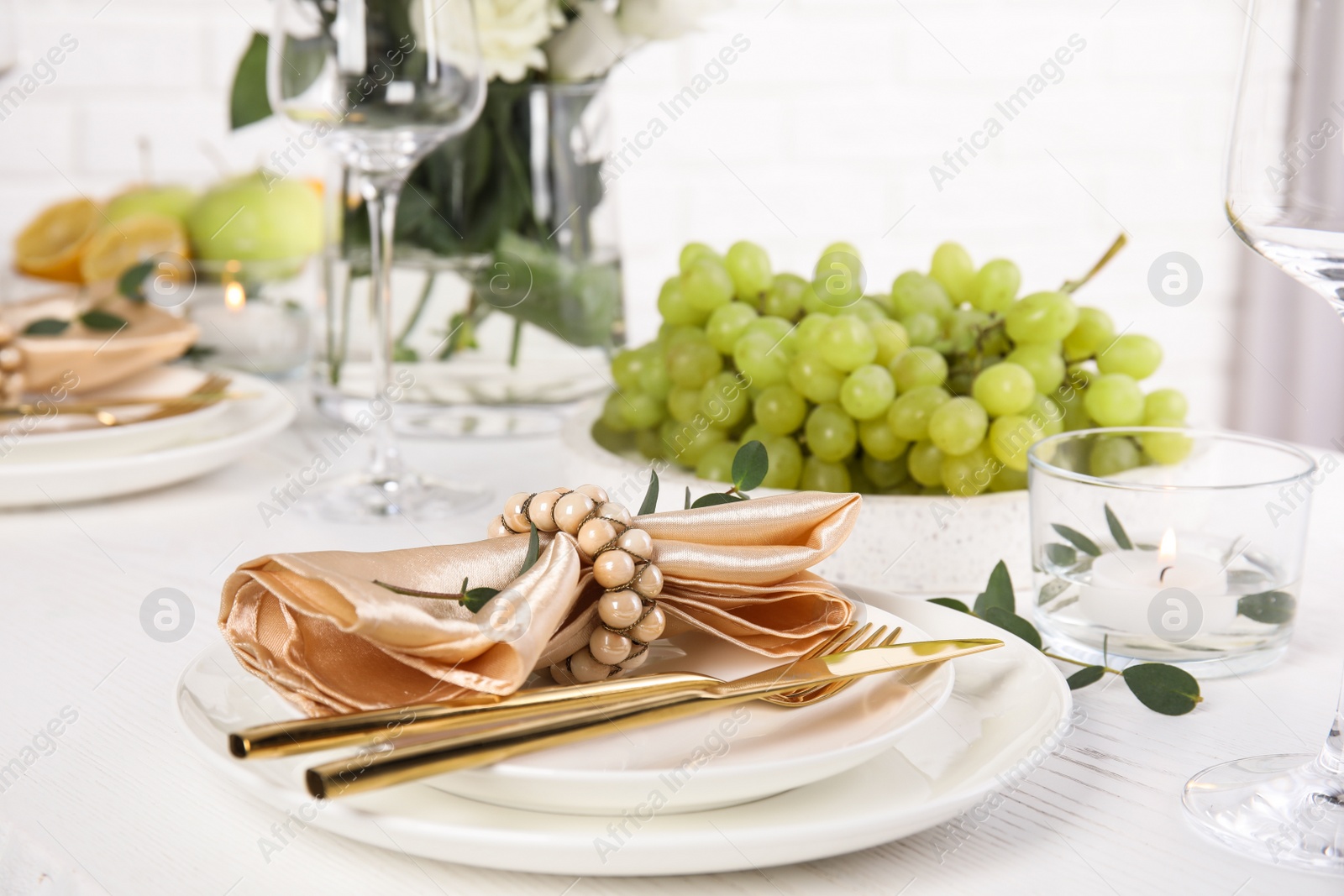 Photo of Elegant table setting with festive decoration in restaurant