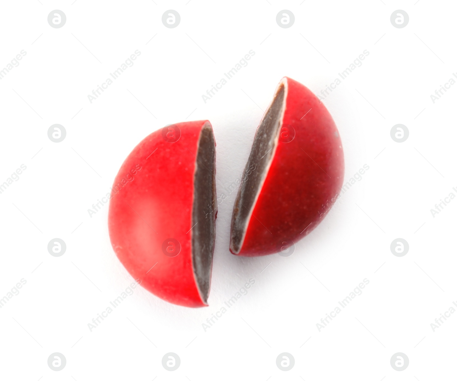 Photo of Chocolate candy cut in half on white background