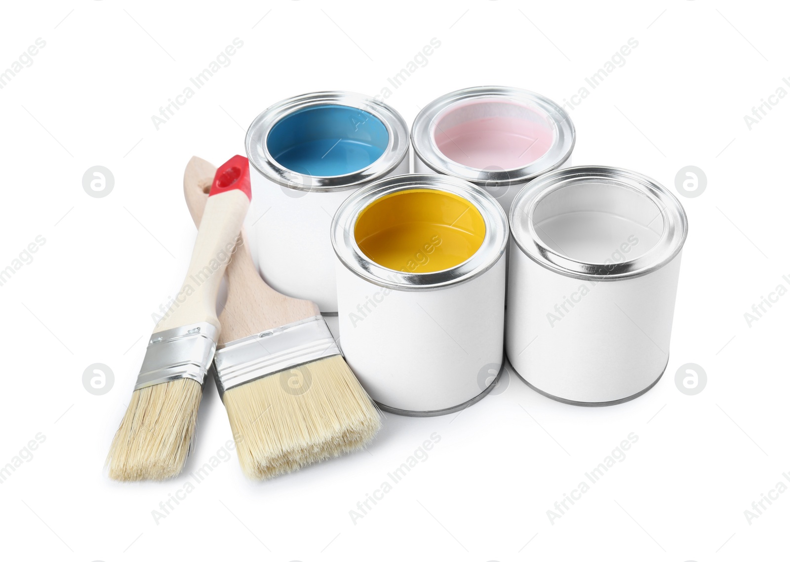 Photo of Cans of colorful paints and brushes isolated on white
