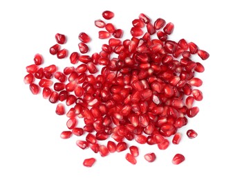 Photo of Tasty pomegranate seeds on white background, top view