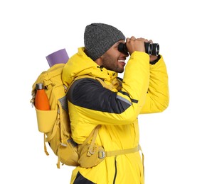 Photo of Happy tourist with backpack looking through binoculars on white background