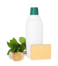 Bottle of cleaning product, brush, sponge and green leaves isolated on white