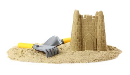 Pile of sand with beautiful castle and plastic toys isolated on white