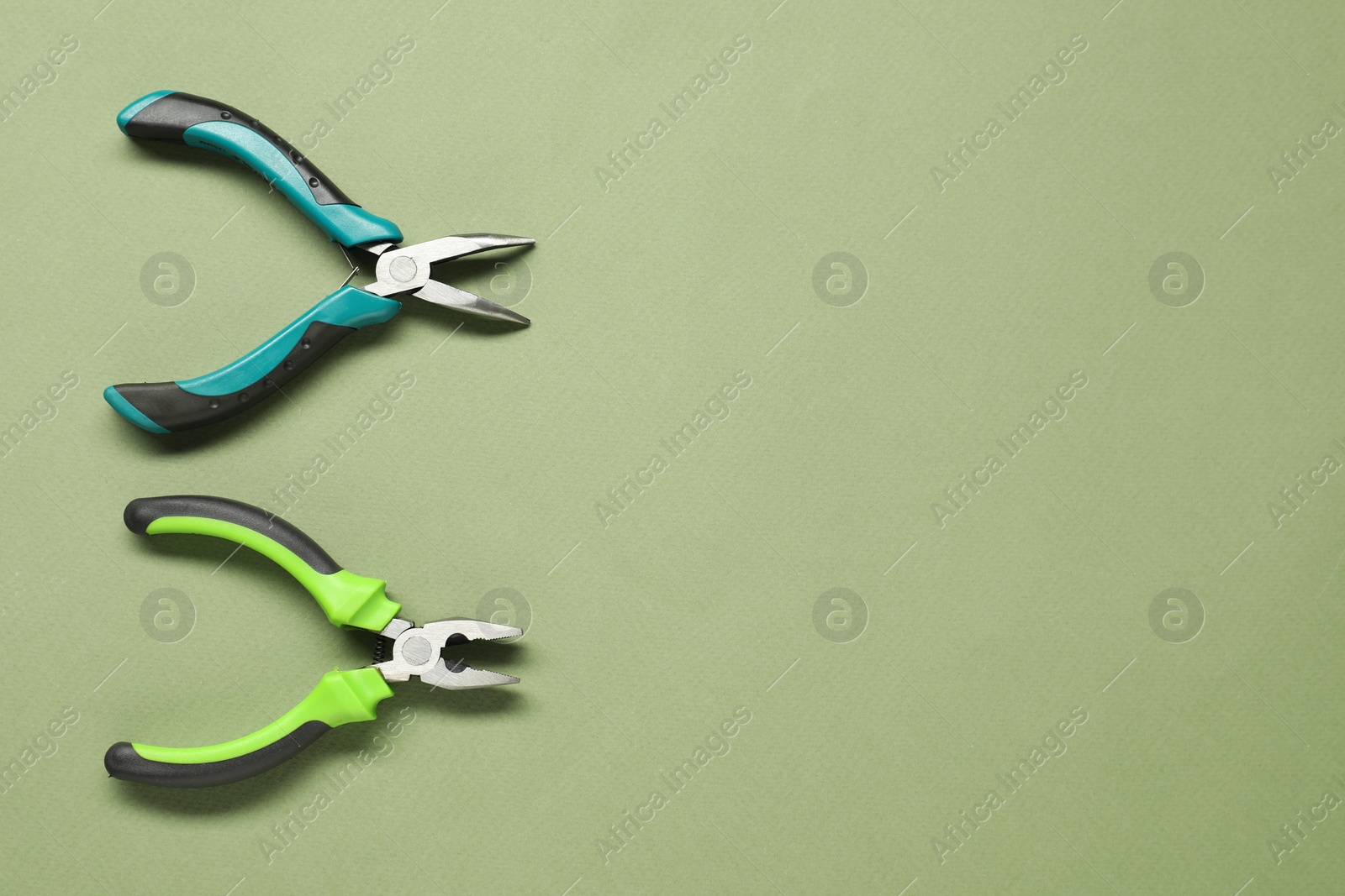 Photo of Pliers on olive background, flat lay. Space for text