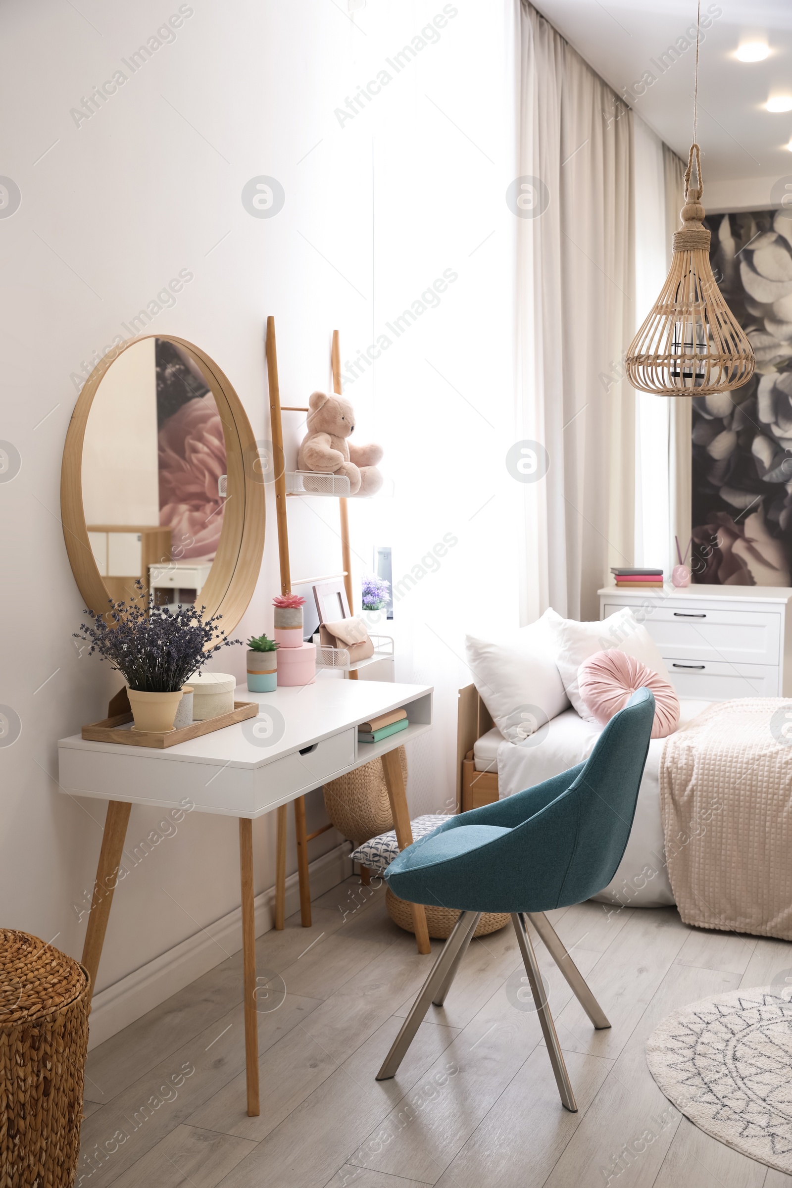 Photo of Teenage girl's bedroom interior with stylish furniture. Idea for design