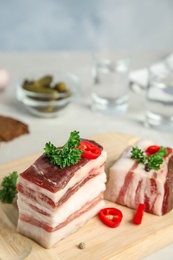 Photo of Composition with bacon and chili pepper on table against blue background. Space for text