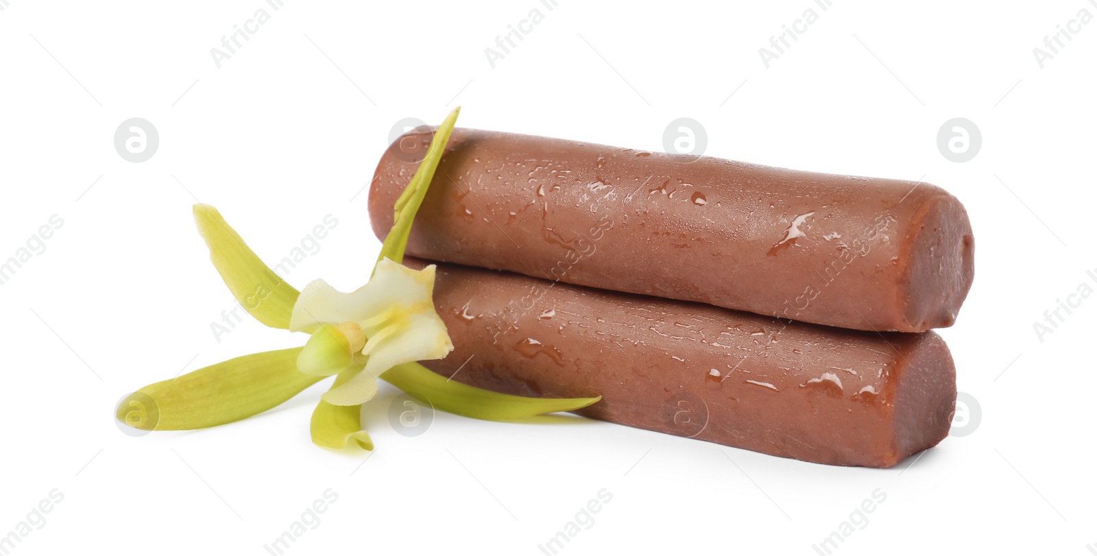 Photo of Glazed curd cheese bars and vanilla flower isolated on white