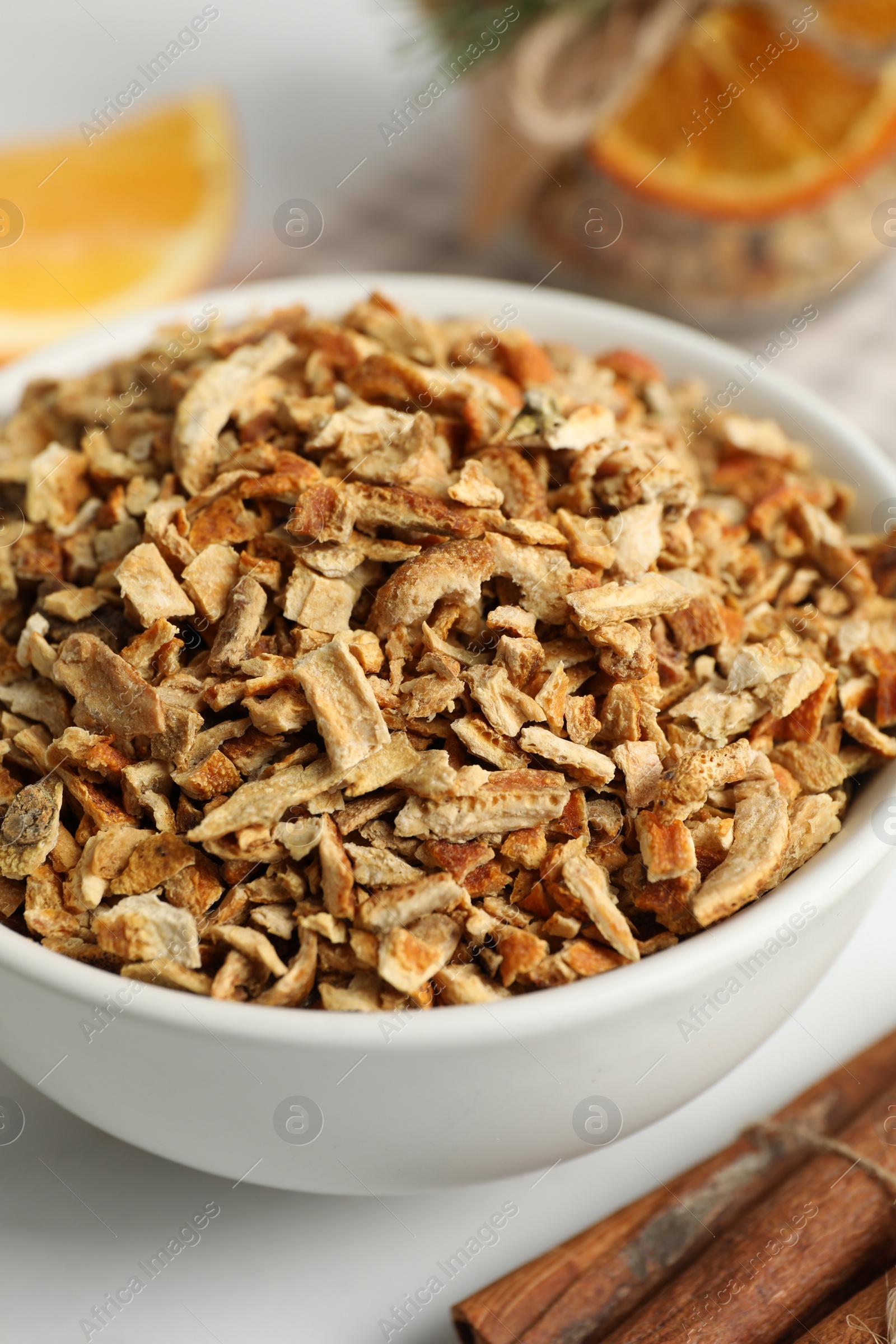 Photo of Bowl of dried orange zest seasoning, closeup