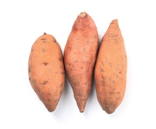 Photo of Heap of whole ripe sweet potatoes on white background, top view