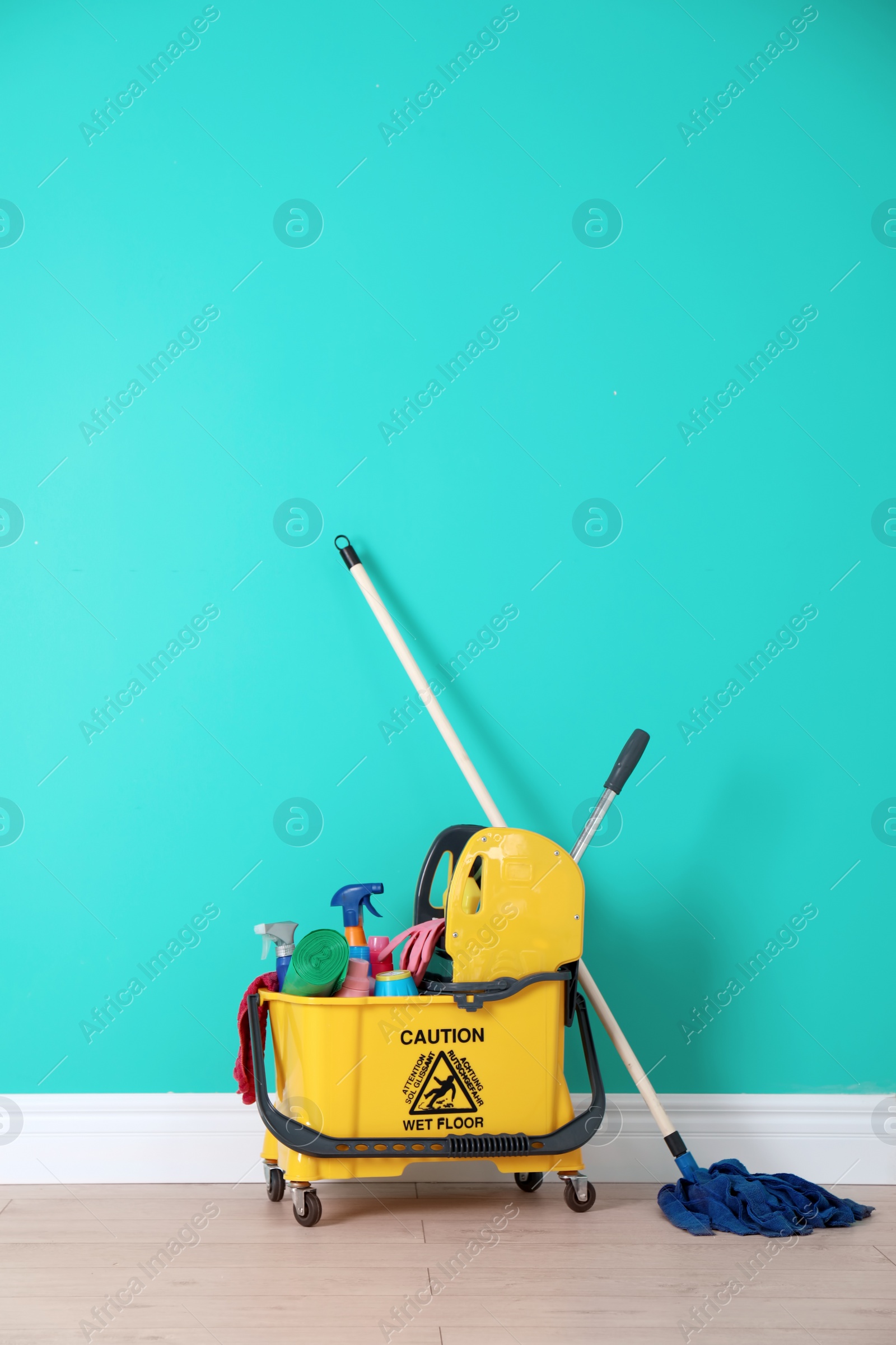 Photo of Set of cleaning supplies on floor indoors