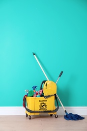 Photo of Set of cleaning supplies on floor indoors