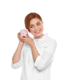 Photo of Portrait of female doctor with piggy bank on white background