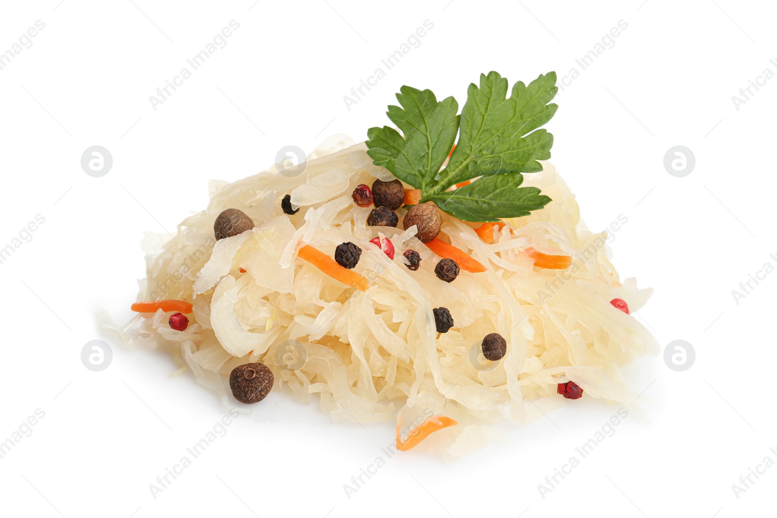 Photo of Tasty fermented cabbage with carrot, spices and parsley on white background