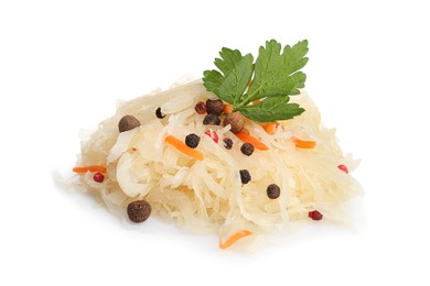 Photo of Tasty fermented cabbage with carrot, spices and parsley on white background