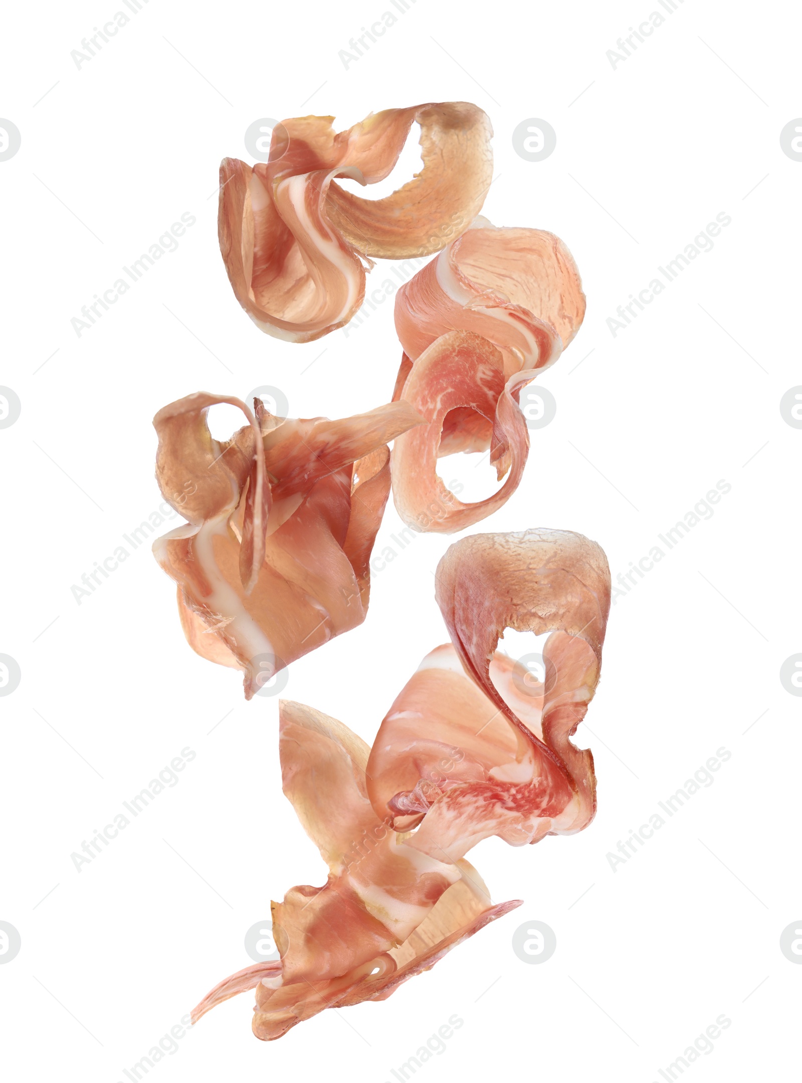 Image of Set of flying cut delicious prosciutto on white background