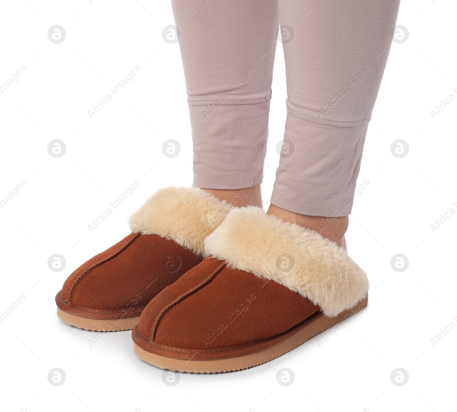 Photo of Woman in soft slippers on white background, closeup