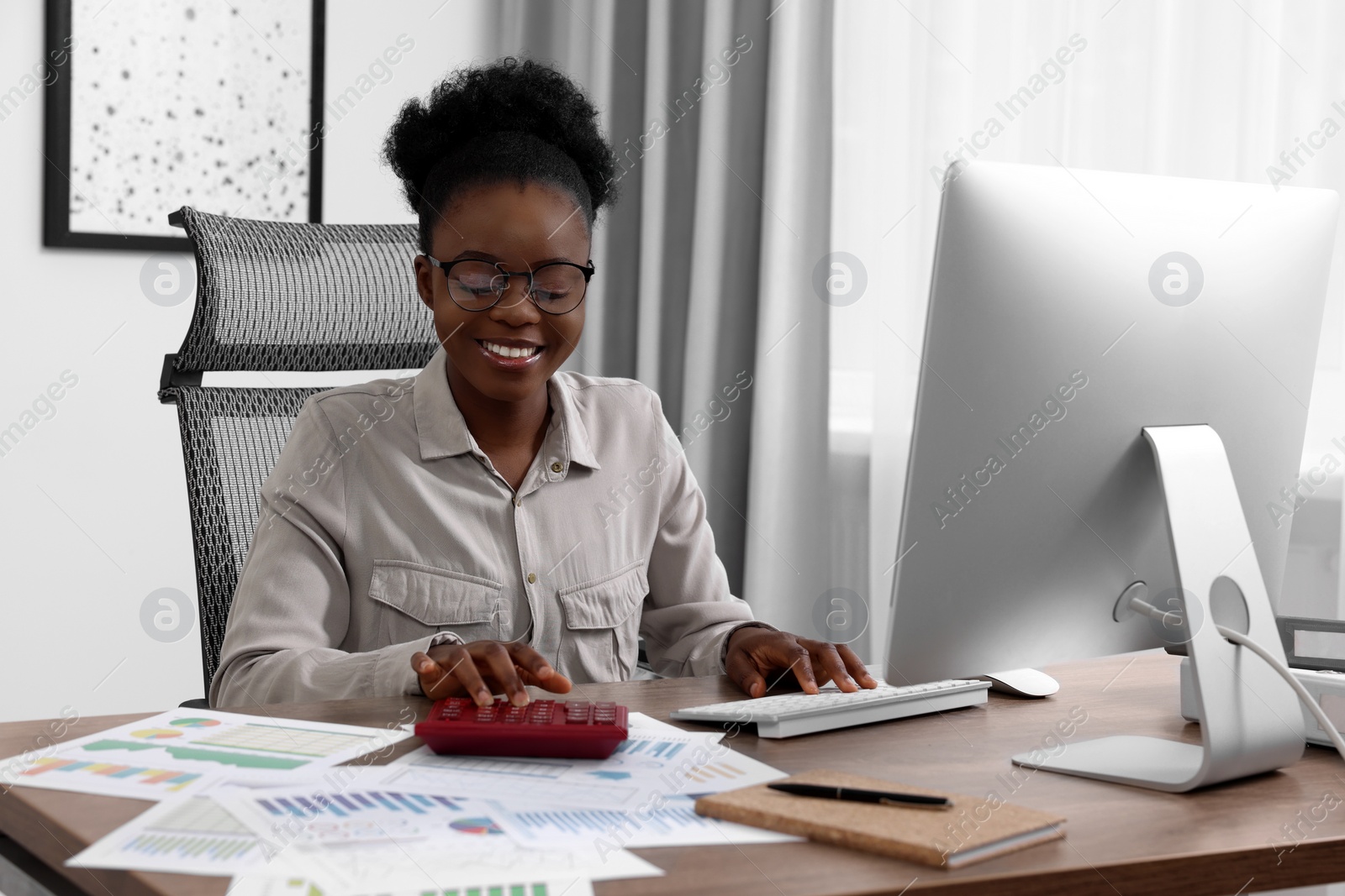 Photo of Professional accountant working at wooden desk in office