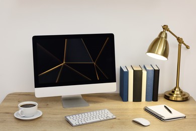 Cozy workspace with computer on wooden desk at home