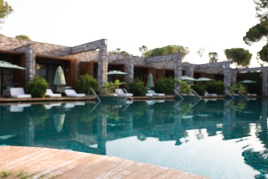 Outdoor swimming pool at resort, blurred view